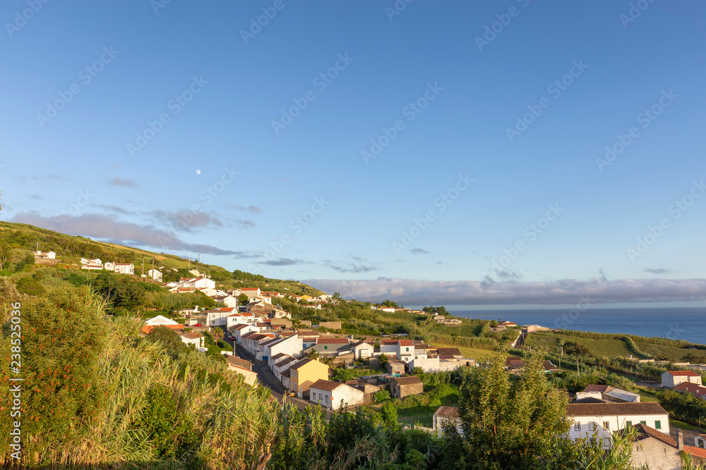 Sunset light hits the houses in the small village of Feteiras in Sao Miguel, Azores.