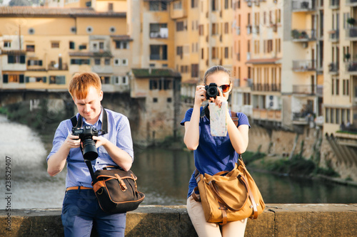 Guy and girl on bridge in front of Ponte Vecchio, Florence