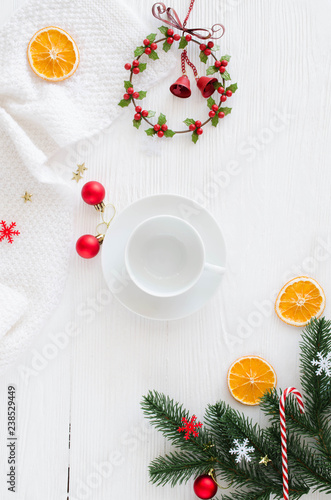 Christmas composition with empty white cup and decorations