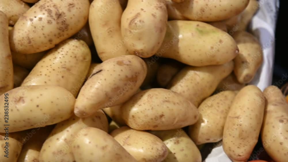 4K Close up fresh potatoes, tomatoes and onion for sale at the market 4K Close up fresh potatoes, tomatoes and onion for sale at the market
