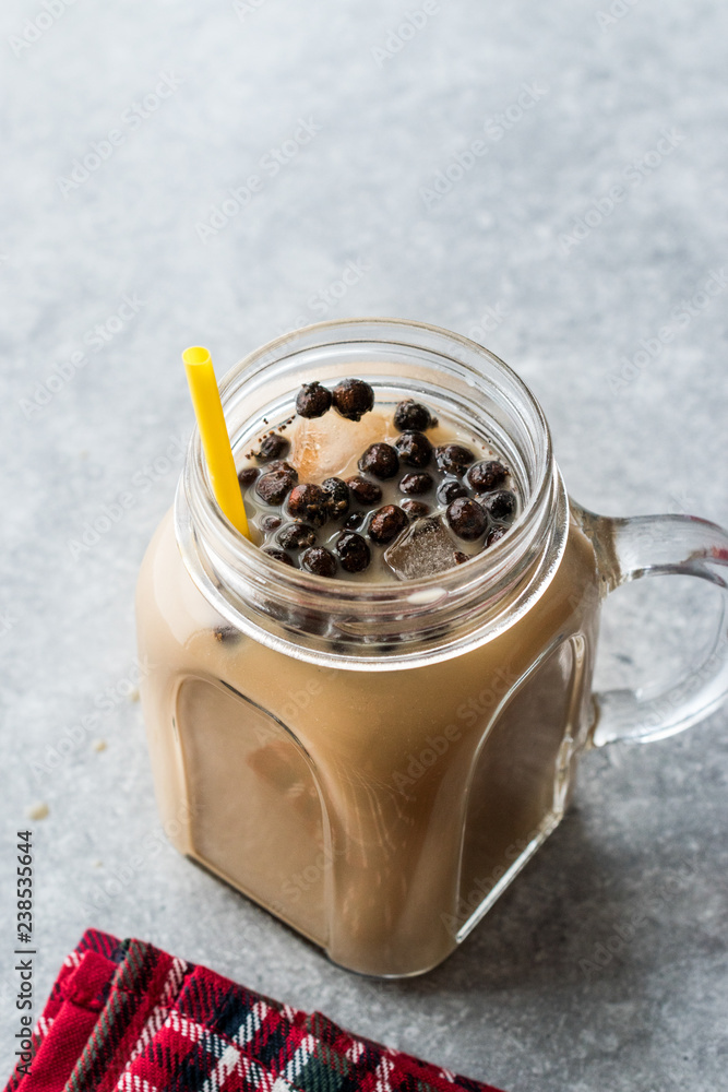 Homemade Milk Bubble Tea with Tapioca Pearls in Mason Jar. Homemade Milk Bubble Tea with Tapioca Pearls in Mason Jar.