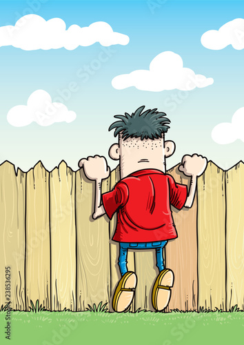 Child looking over wooden fence