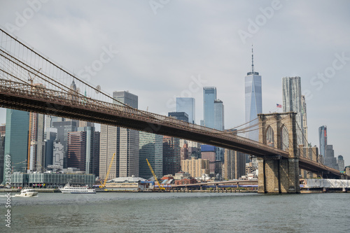 View on Brooklyn bridge and on skycrapers behind in New York City