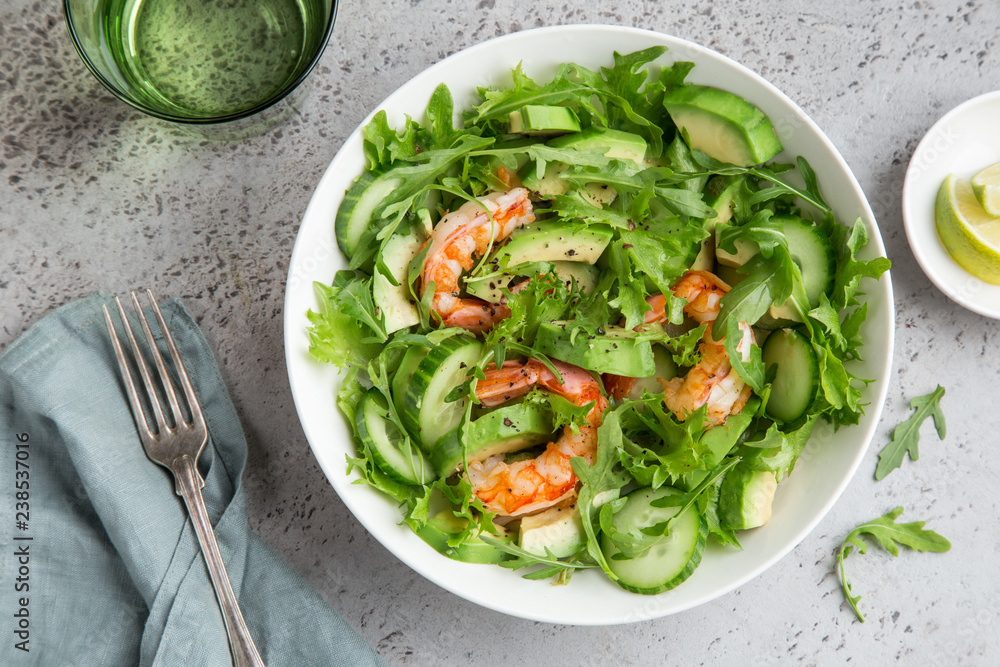 healthy avocado and prawn salad in white bowl healthy avocado and prawn salad in white bowl