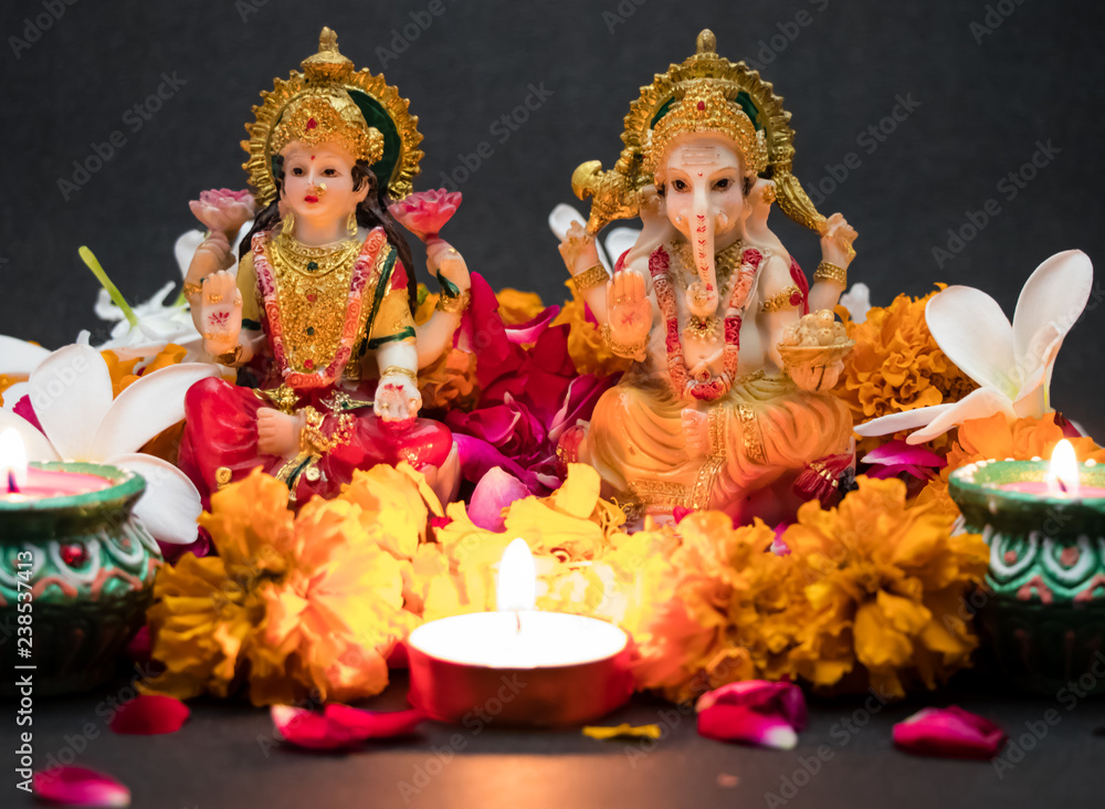 Hindu God Laxmi Ganesh with Candle Light at Diwali Festival Hindu God Laxmi Ganesh with Candle Light at Diwali Festival