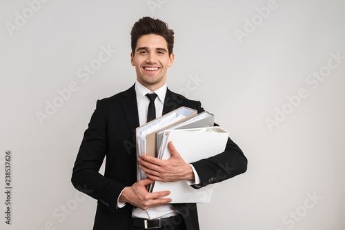 Tired business man wearing suit standing