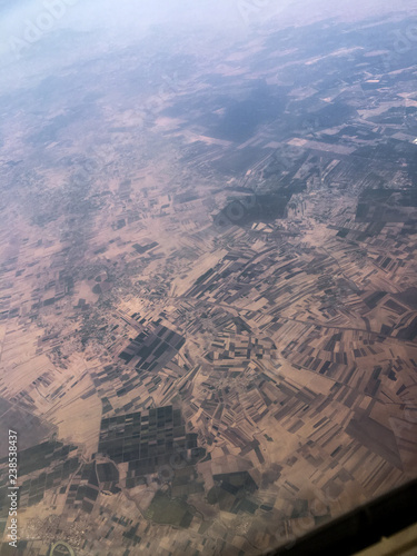 Aerial view from plane to African desert farming over Morocco