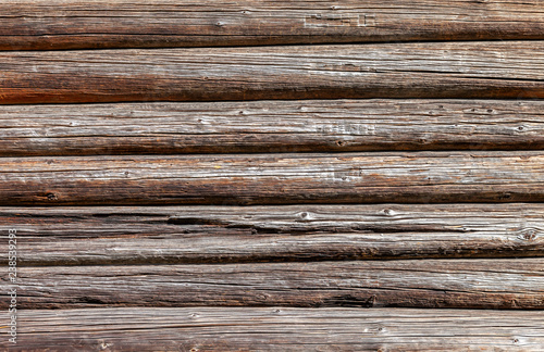 Wooden logs wall of old house as background