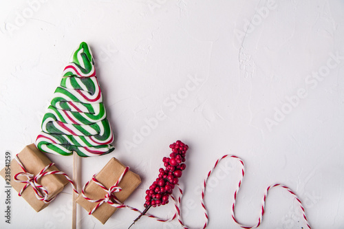 Christmas composition flat lay, red and green, presents, twine, christmas candy, flat lay