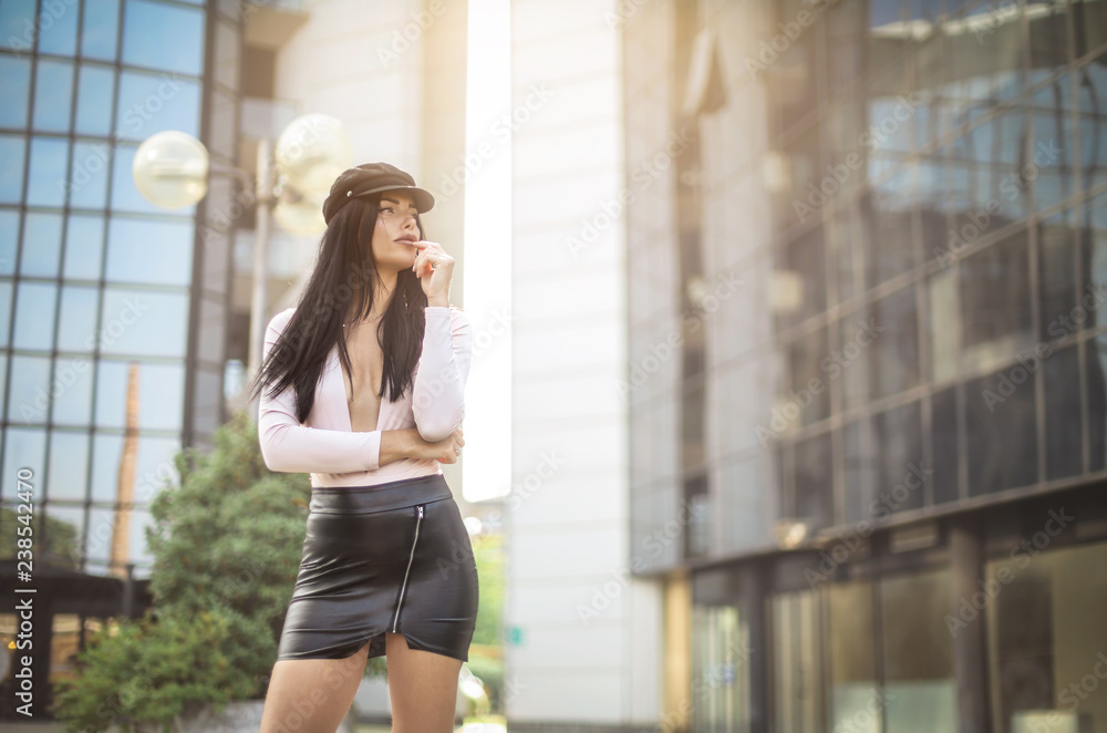 Beautiful attractive woman standing in the street Beautiful attractive woman standing in the street
