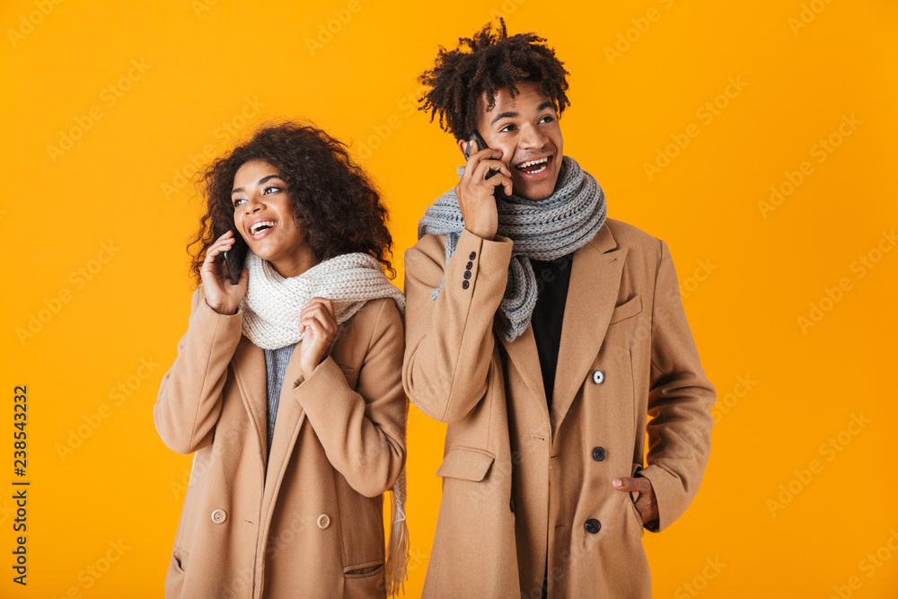 Happy african couple wearing winter clothes Happy african couple wearing winter clothes
