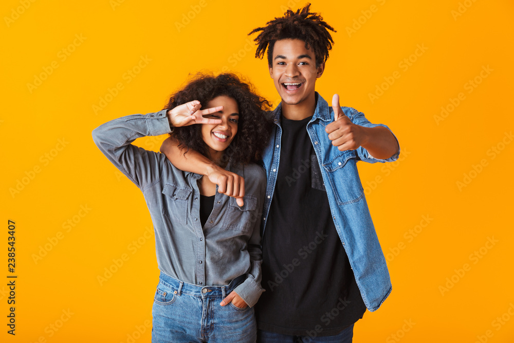 Happy young african couple wearing casual clothes Happy young african couple wearing casual clothes