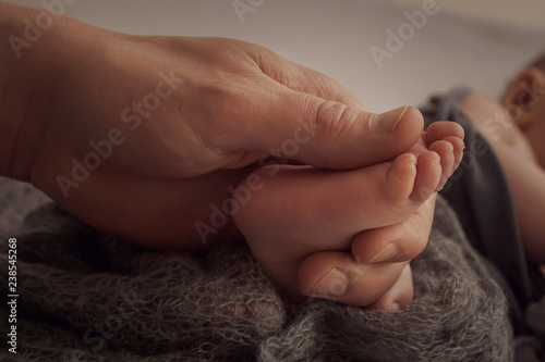 Baby feet in papas hand