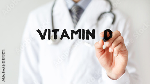 Doctor writing word Vitamin  d with marker, Medical concept