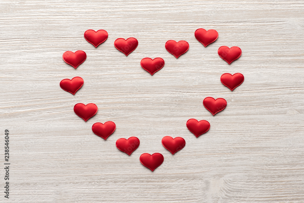 red heart nested heart on wooden background top view. Valentine's Day. 14 february. red heart nested heart on wooden background top view. Valentine's Day. 14 february.