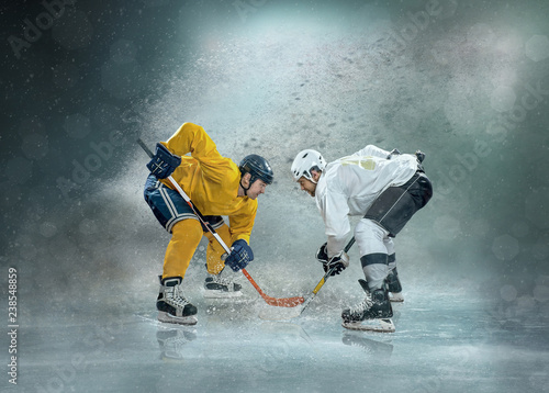 Caucasian ice hockey Players in dynamic action in professional