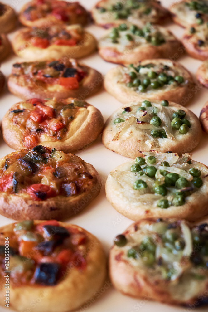 Freshly baked mini pizzas Cocas Freshly baked mini pizzas Cocas