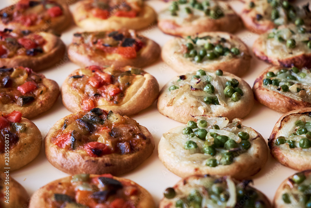 Freshly baked mini pizzas Cocas Freshly baked mini pizzas Cocas