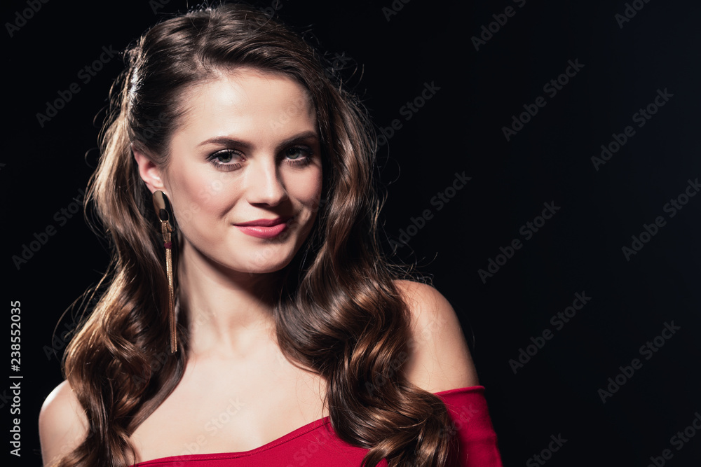 portrait of beautiful smiling woman looking at camera isolated on black portrait of beautiful smiling woman looking at camera isolated on black