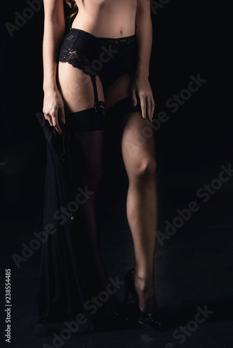 Fototapeta Naklejka Na Ścianę i Meble -  cropped view of sexy woman in lingerie isolated on black