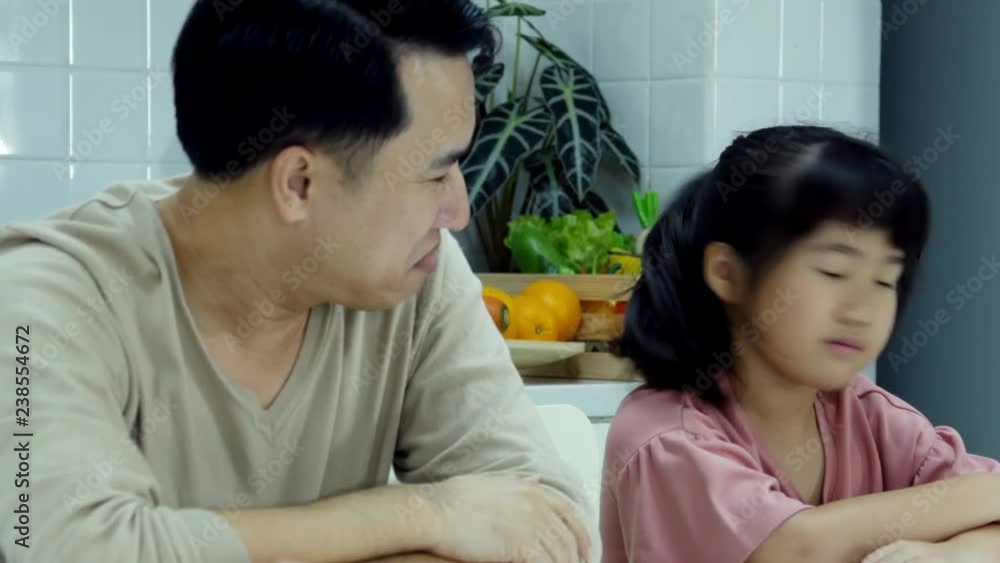 Little girl annoyed her father when they playing with each other. Little girl annoyed her father when they playing with each other.
