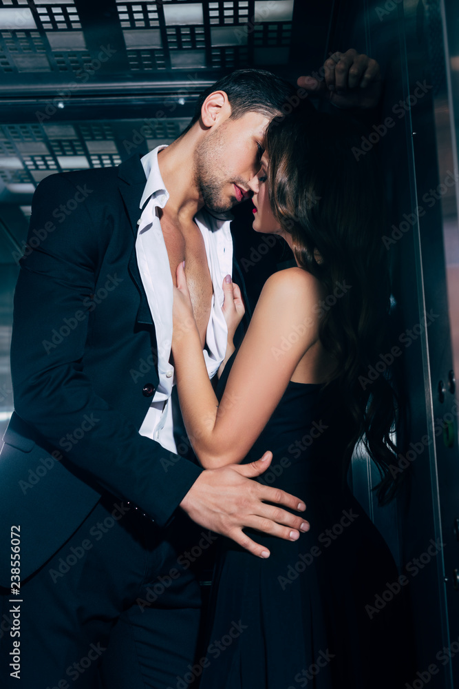sexy young couple passionately kissing in elevator Stock Photo Adobe