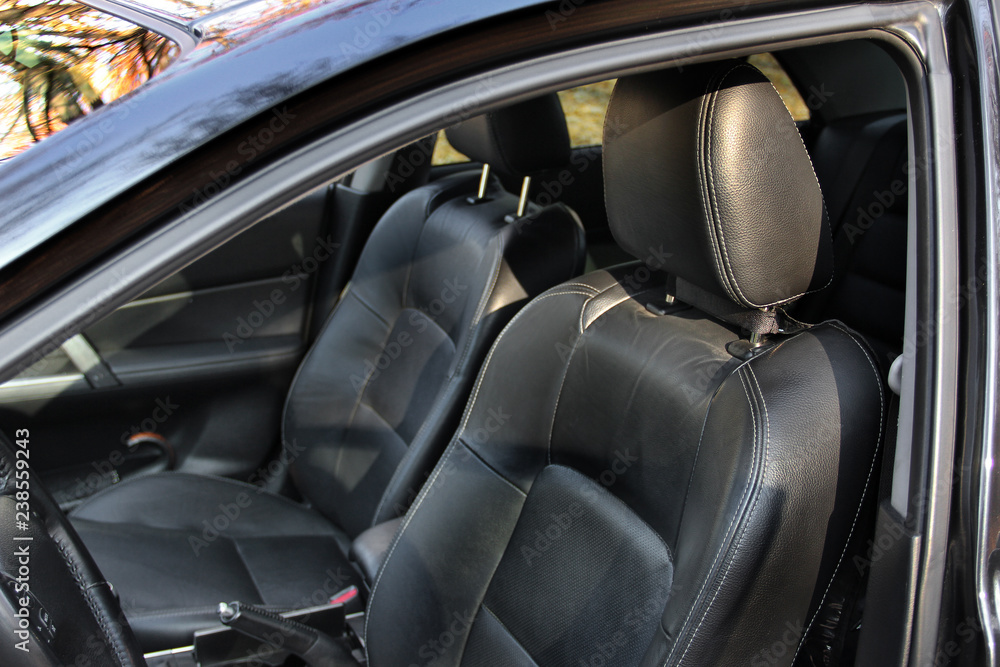 Black leather car seats. Luxury car interior