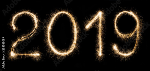 2019 written with a sparklers isolated on black background