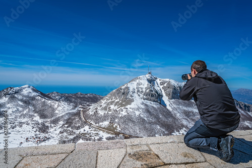 Tourist taking pictures of the Stirovnik peak