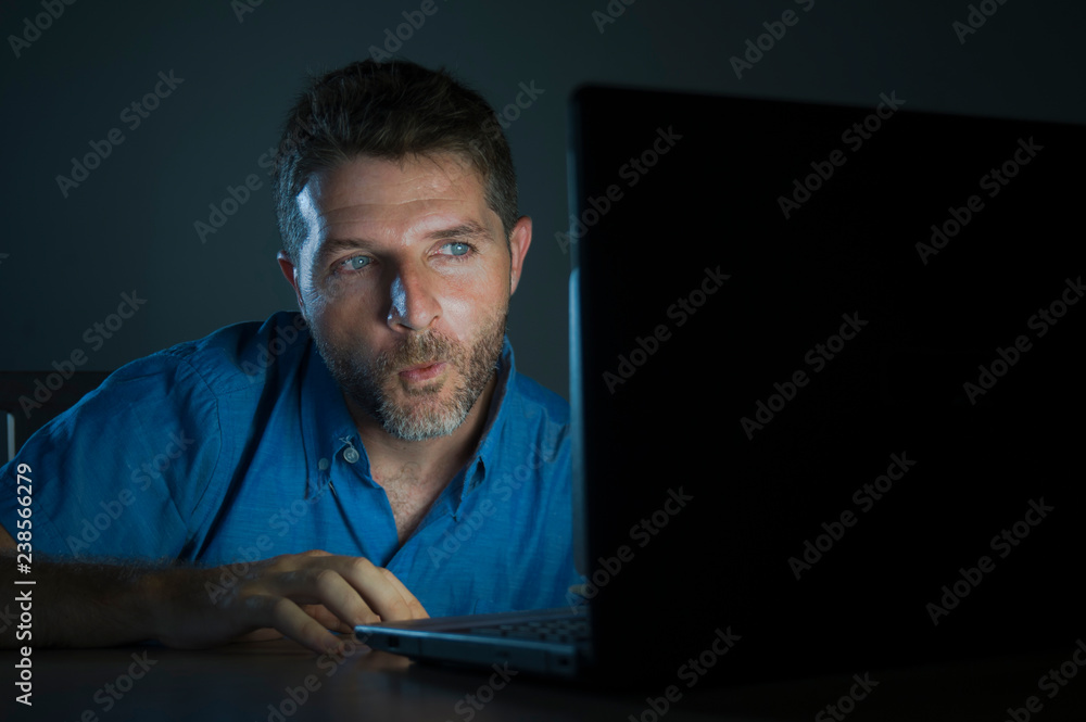 young aroused and excited sex addict man watching porn mobile online in laptop computer light night at home in pornography addiction internet pornographic content Stock Photo Adobe Stock