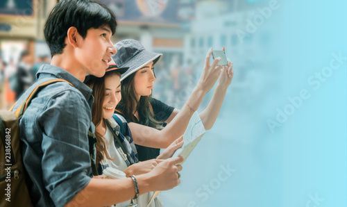 travel concept.group of traveller friend with trikets counter and time table background. photo