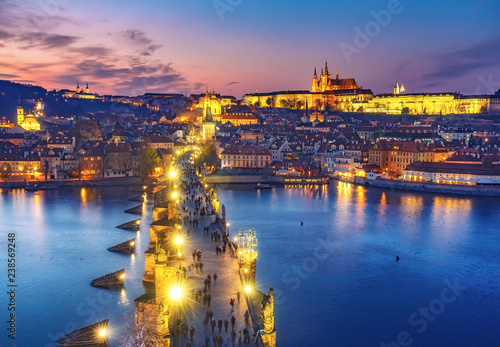 Fotografering Scenic aerial view on Charles bridge and Prague castle in Prague, Czech Republic, at sunset