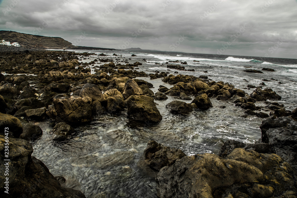 stony ocean shore of lanzarote island stony ocean shore of lanzarote island