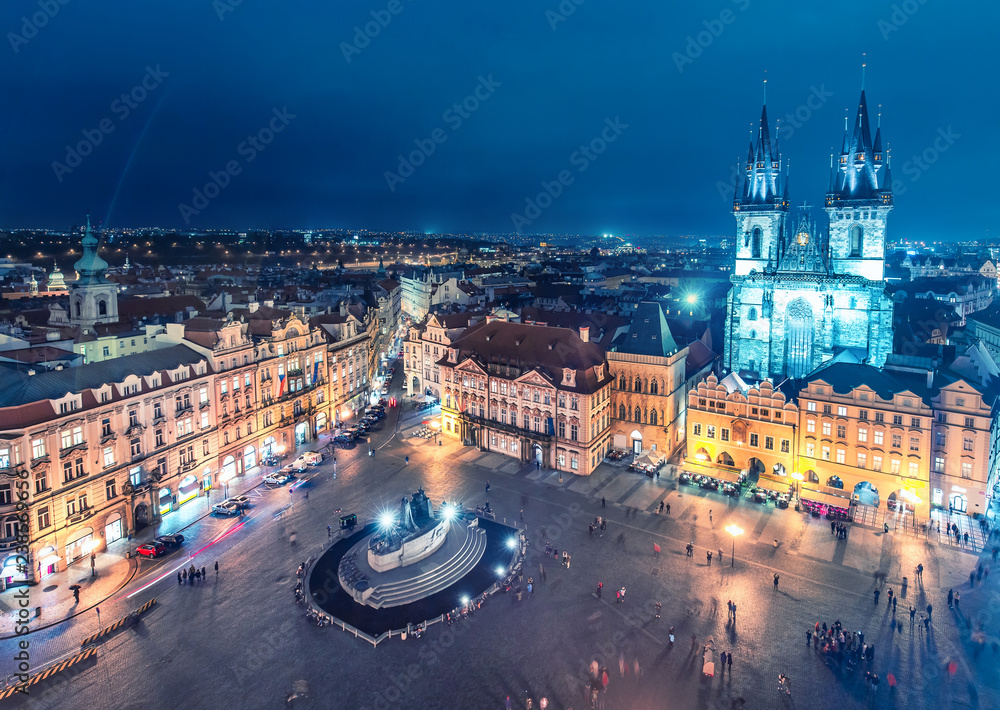 Aerial view on Old town with Tyn church in Prague, Czech republic, at night. Colourful skyline.