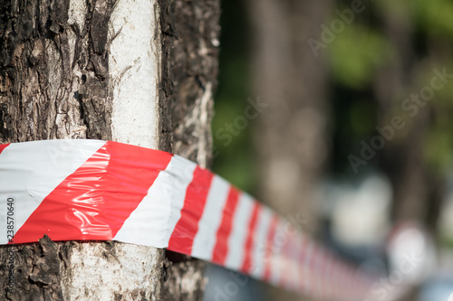 Red and white striped tape of a dangerous zone