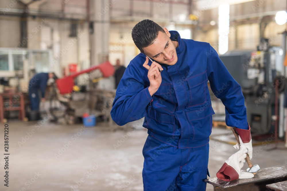 Male engineer being lazy and talking on the phone while he's on duty Male engineer being lazy and talking on the phone while he's on duty