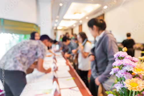abstract blur of people registering before meeting begin, registration
