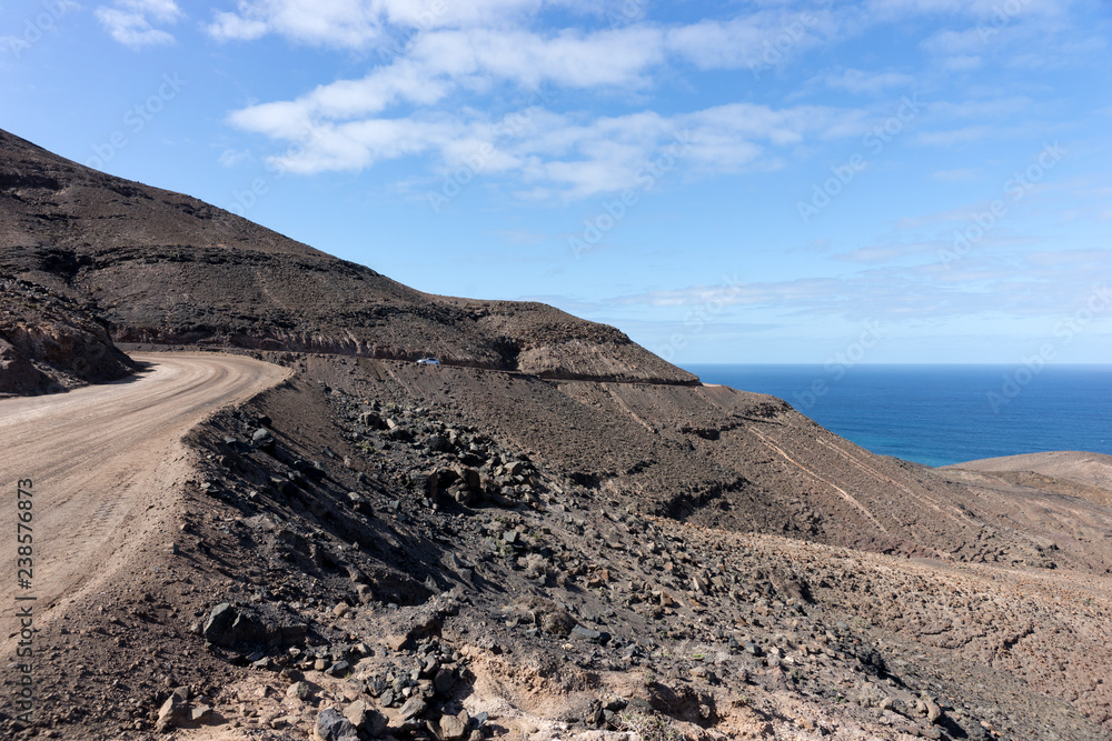 Dirty road leading to Cofete beach in Fuerteventura. Canary Islands. Spain