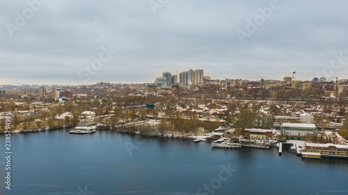 Aerial view from drone on the cityscape on the shore of Dnieper river in Dnipro city, Ukraine.