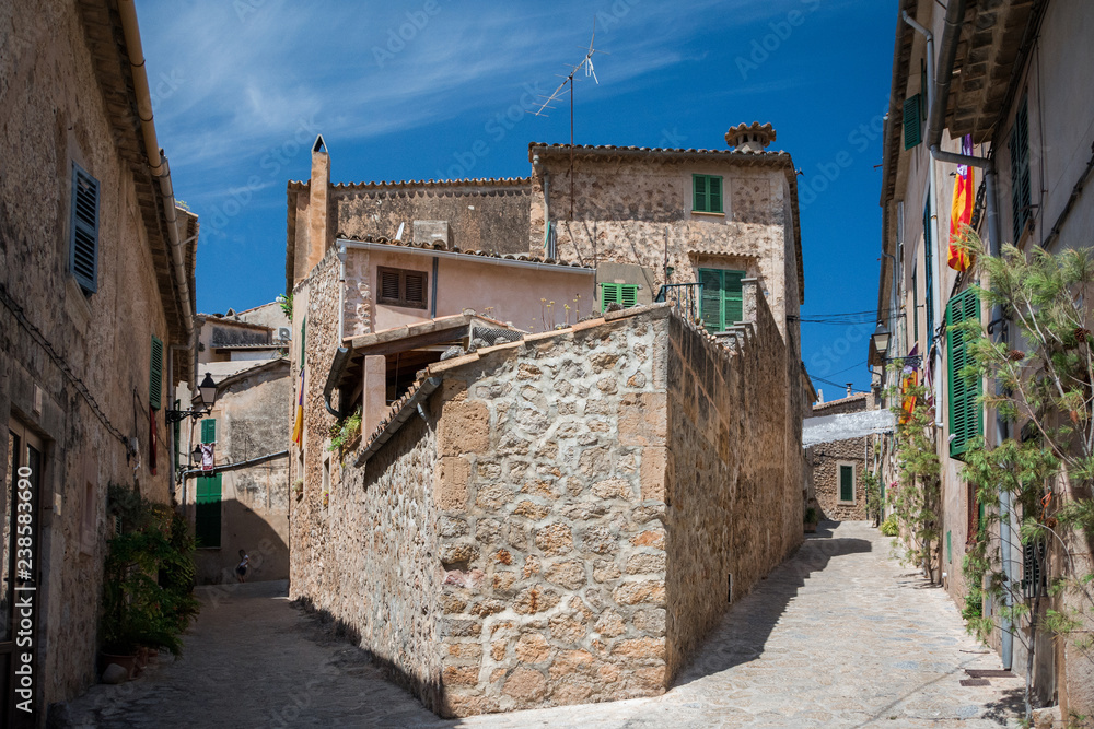 Valldemossa, Mallorca, Balearic Islands, Spain - July 21, 2013: View of the narrow streets of Valldemossa