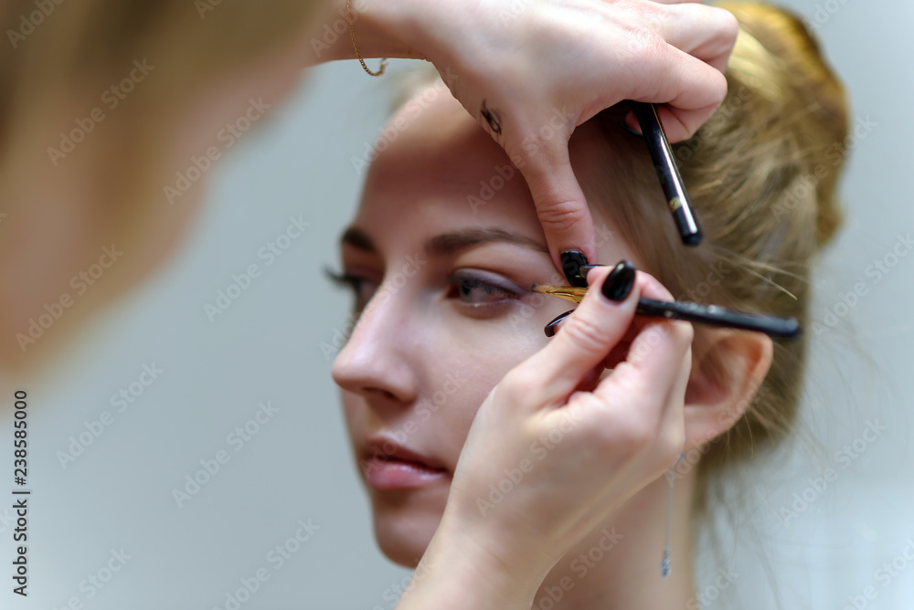 The concept of the work of the master makeup artist beautician. The concept of the work of the master makeup artist beautician.