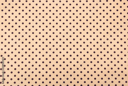 Beige paper background. Paper polka dot background. Paper texture