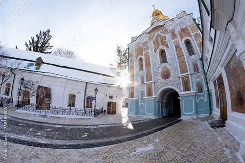 Winter view of the main entrance to the Kiev -Pechersk Lavra with the chapel and the yard photo