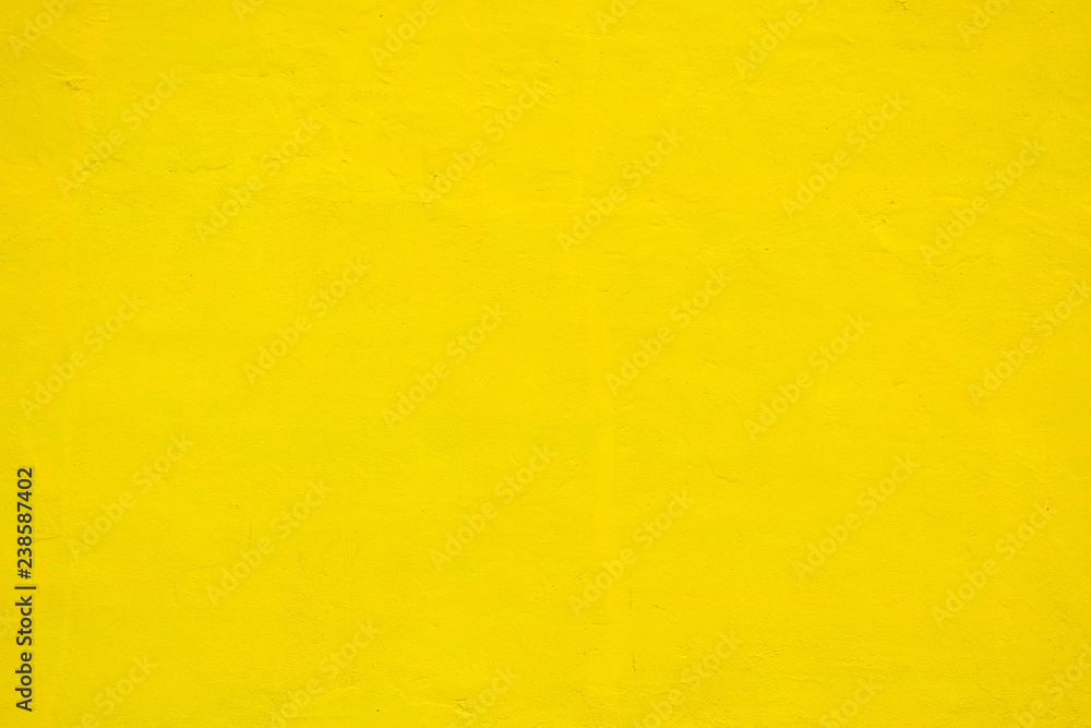 Yellow concrete wall texture at building - background Yellow concrete wall texture at building - background