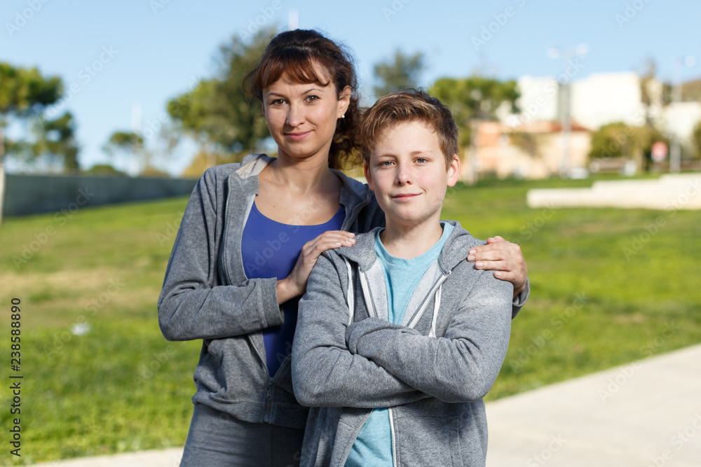 Fototapeta premium Family in sportswear standing outdoors