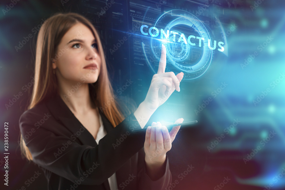 The concept of business, technology, the Internet and the network. A young entrepreneur working on a virtual screen of the future and sees the inscription: Contact us The concept of business, technology, the Internet and the network. A young entrepreneur working on a virtual screen of the future and sees the inscription: Contact us