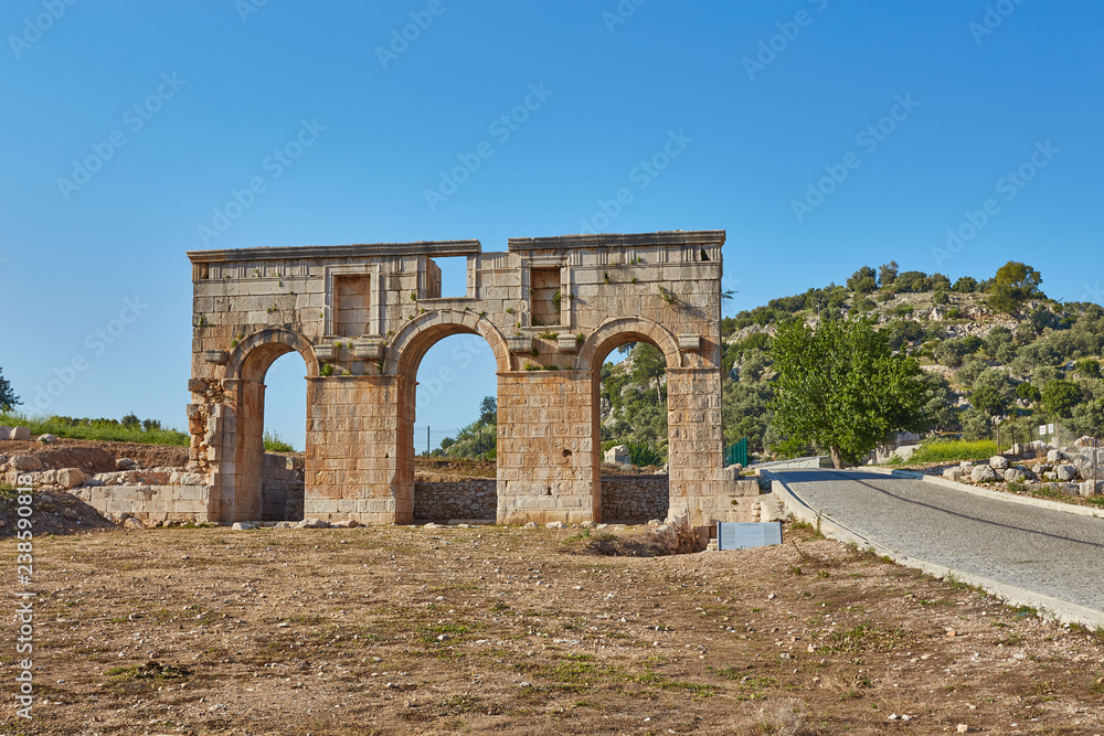 The well preserved ancient triple arched Triumphal Arch located at the entrance to the Patara ancient city