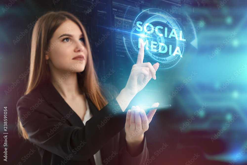 The concept of business, technology, the Internet and the network. A young entrepreneur working on a virtual screen of the future and sees the inscription: Social media The concept of business, technology, the Internet and the network. A young entrepreneur working on a virtual screen of the future and sees the inscription: Social media