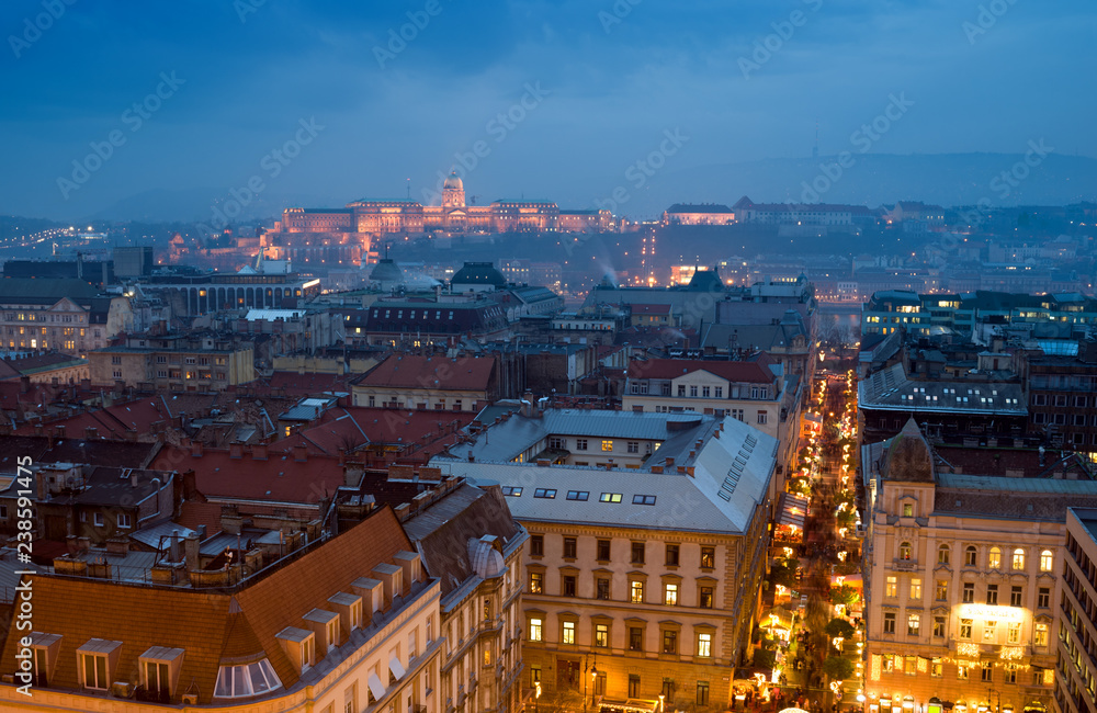 Illuminated street against Budapest city view featuring Royal Palace