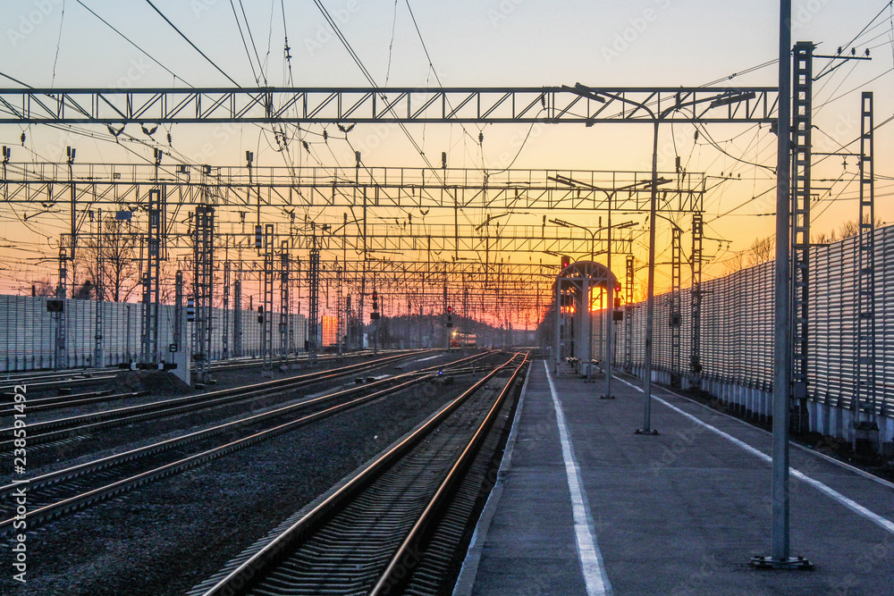 railway at sunset public transport. transportation of people and freight.